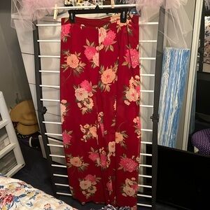 Red floral flowery pants with slits up the side. Shorts underneath, never worn